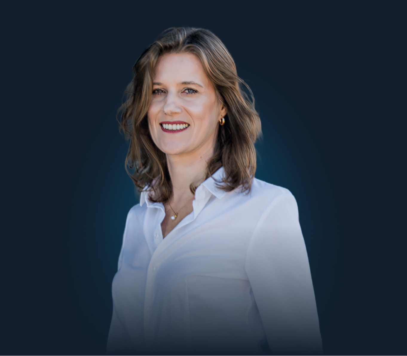 Portrait photo of a marketing specialist smiling at a user.